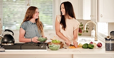 Two women cooking in the kitchen