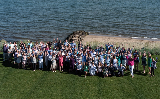 Cape and Coast employees posing for a birds eye view picture