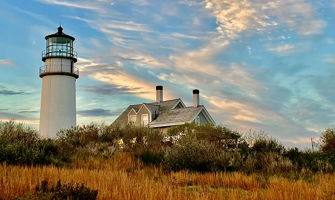 A cape cod house with a lighthouse