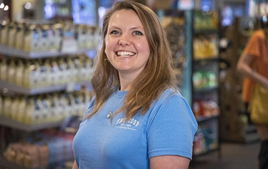 Cotuit Fresh Market owner, Megan, smiles while standing in her market.