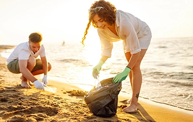 Volunteers picking trash up at the beach