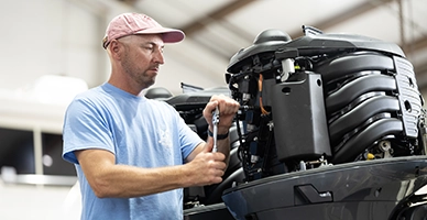 A man working on a boat engine