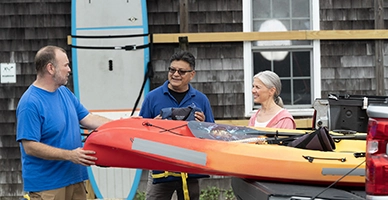 A couple renting kayaks