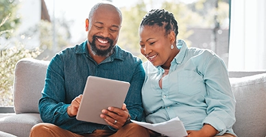 A couple looking at an ipad
