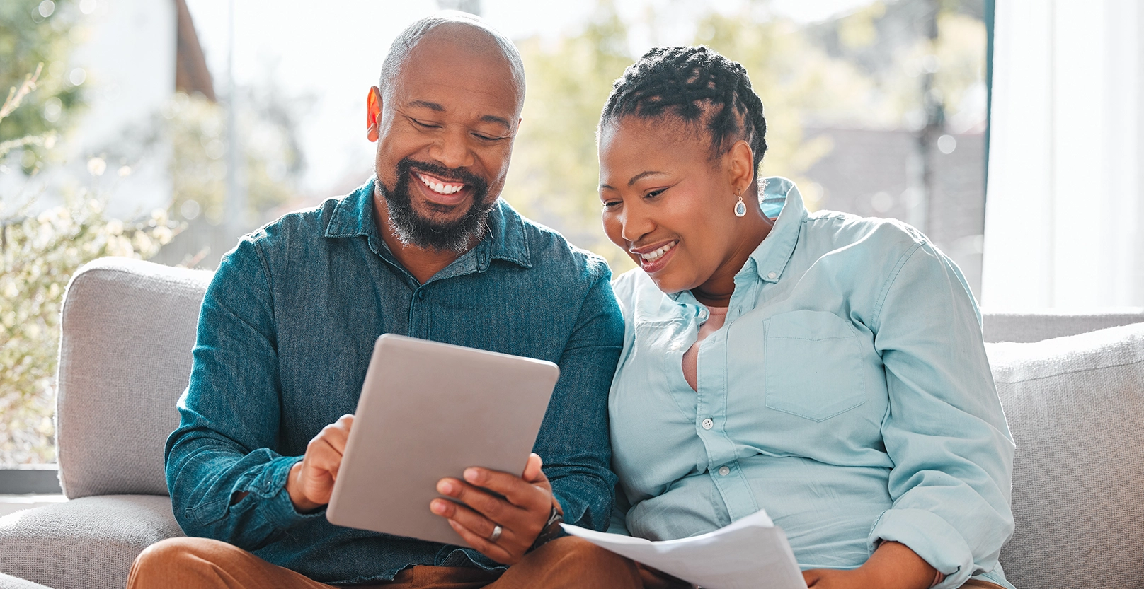 A couple looking at an ipad