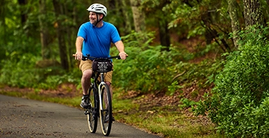 A man riding a bike in a trail