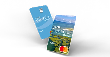 two consumer Cape & Coast debit cards, one blue with logo mark and the other an aerial photo above Gray's Beach in Yarmouth Port.