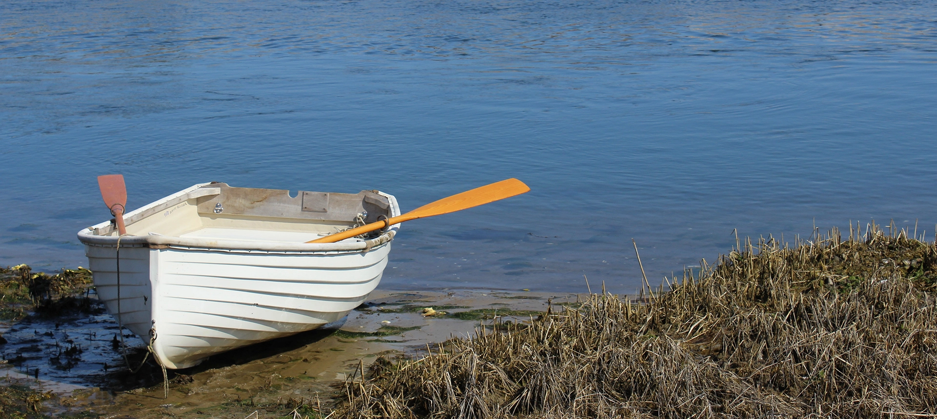 dingy beached at low tide