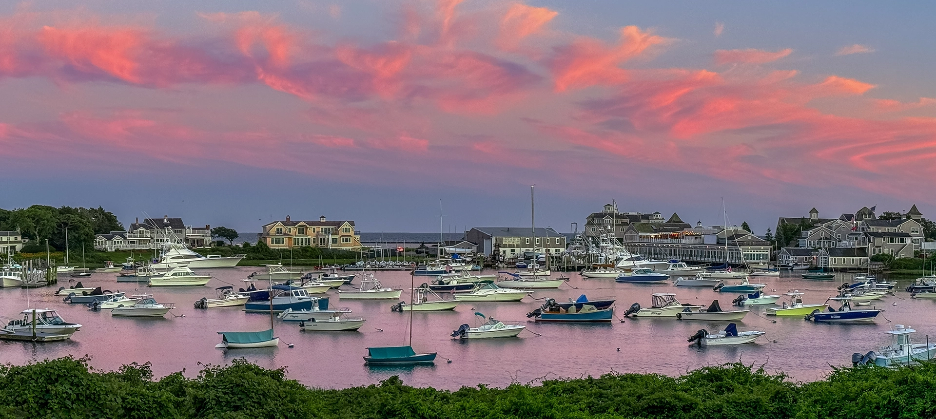 Boats anchored on the coast at sunset