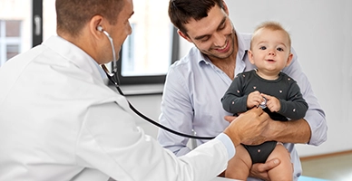 A father with his baby at the doctors