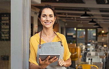 A store owner using an ipad