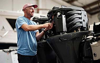 A man working on a boat engine