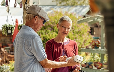 A customer paying for her goods with a card machine