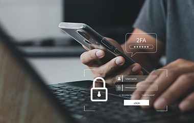 A graphic of someone using a phone with security and 2FA on the screen