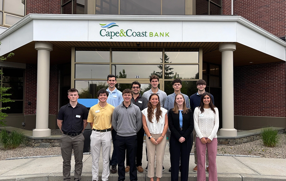 group photo of 2026 incoming interns stand in front of Cape & Coast Bank Headquarters