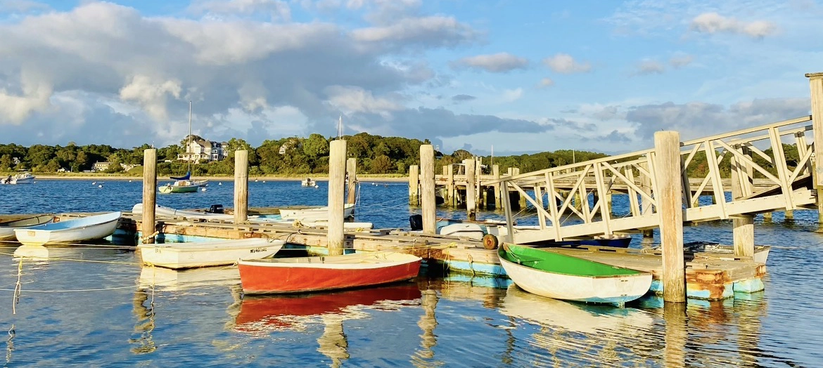 multi-colored dinghys at a harbor in North Falmouth
