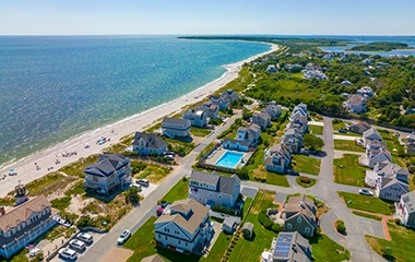 Birds eye view of cape cod houses on the coast