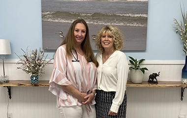 Two health service employees posing for a picture