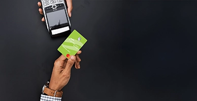 A customer paying a merchant with a debit card