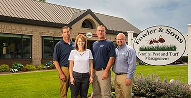 A family standing in front of a family business